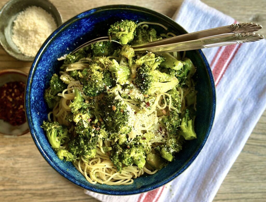 a bowl of food with broccoli