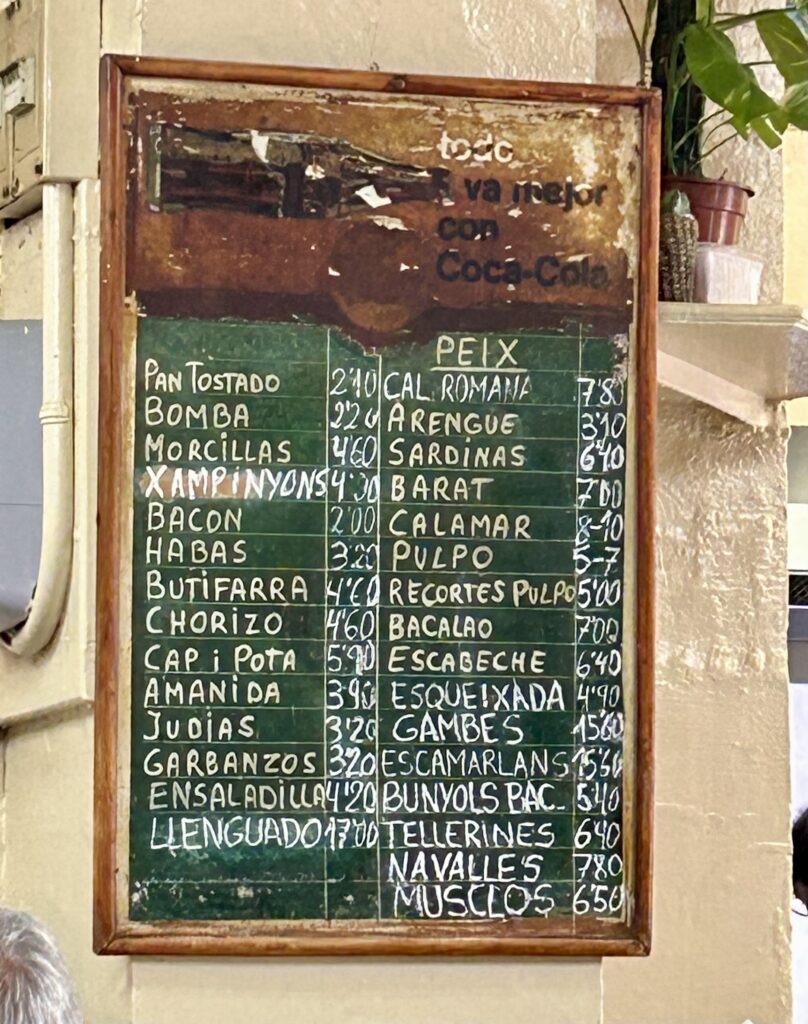 A sign with writing on it