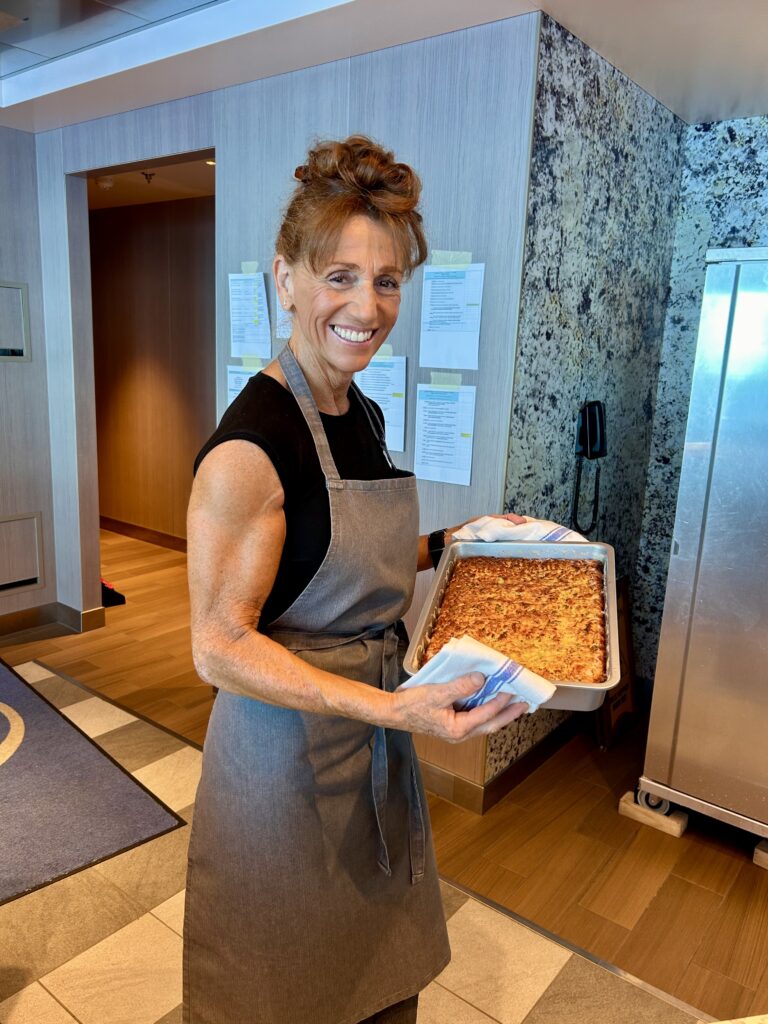 A woman holding a tray of food