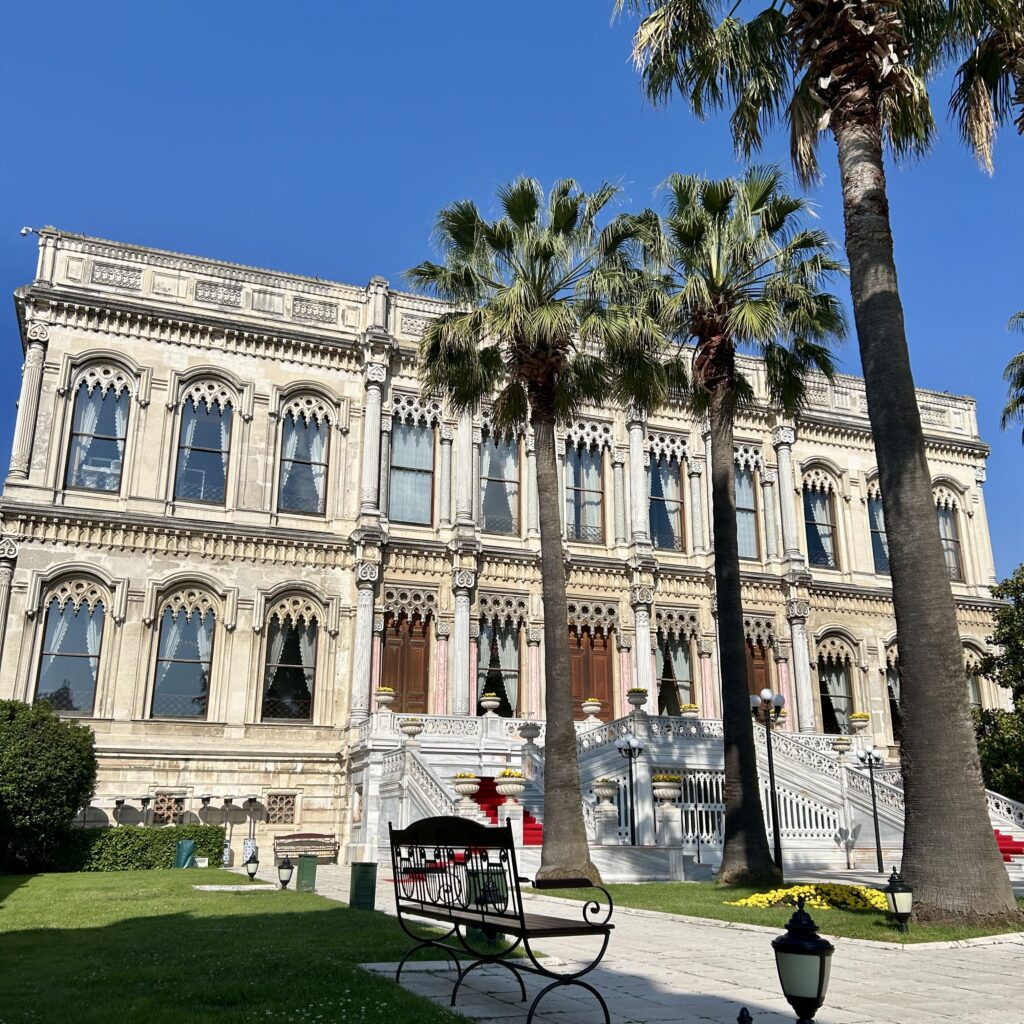 A large building with palm trees