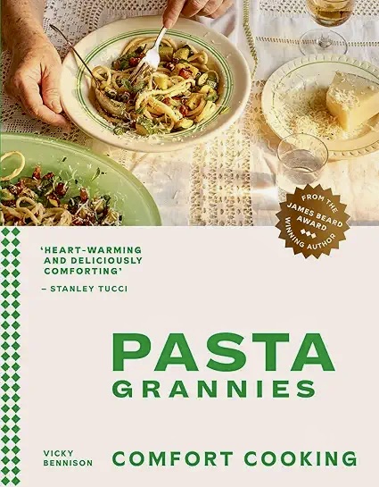 A book cover with a plate of pasta and a glass of cheese