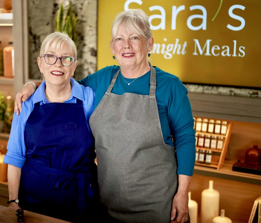 Two women standing next to each other