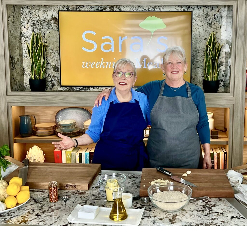 Two women standing in a kitchen
