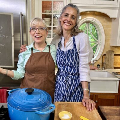 Two women standing in a kitchen