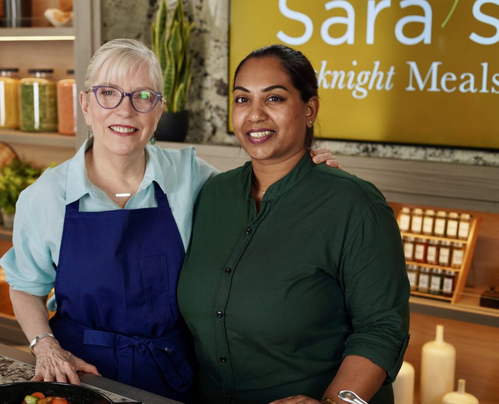 A couple of women standing next to each other