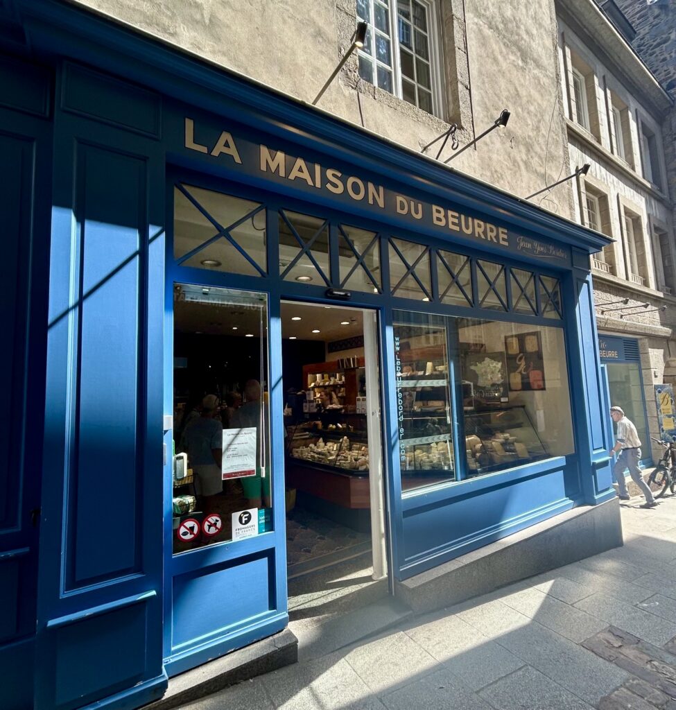 A store front with a blue door