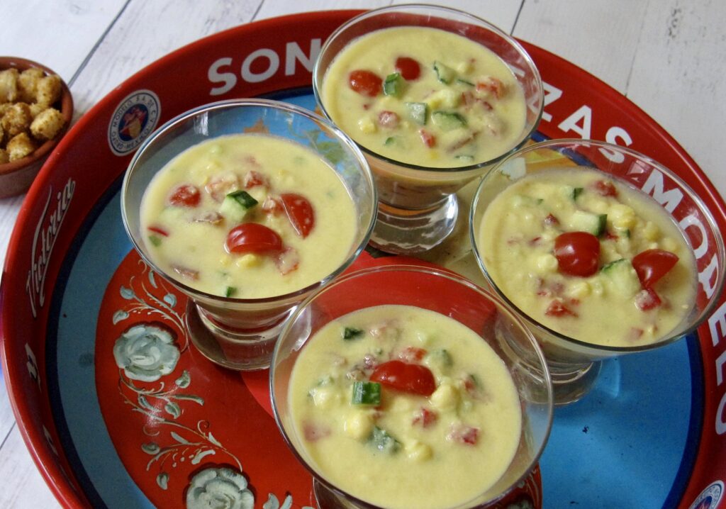 A group of glasses of soup on a plate